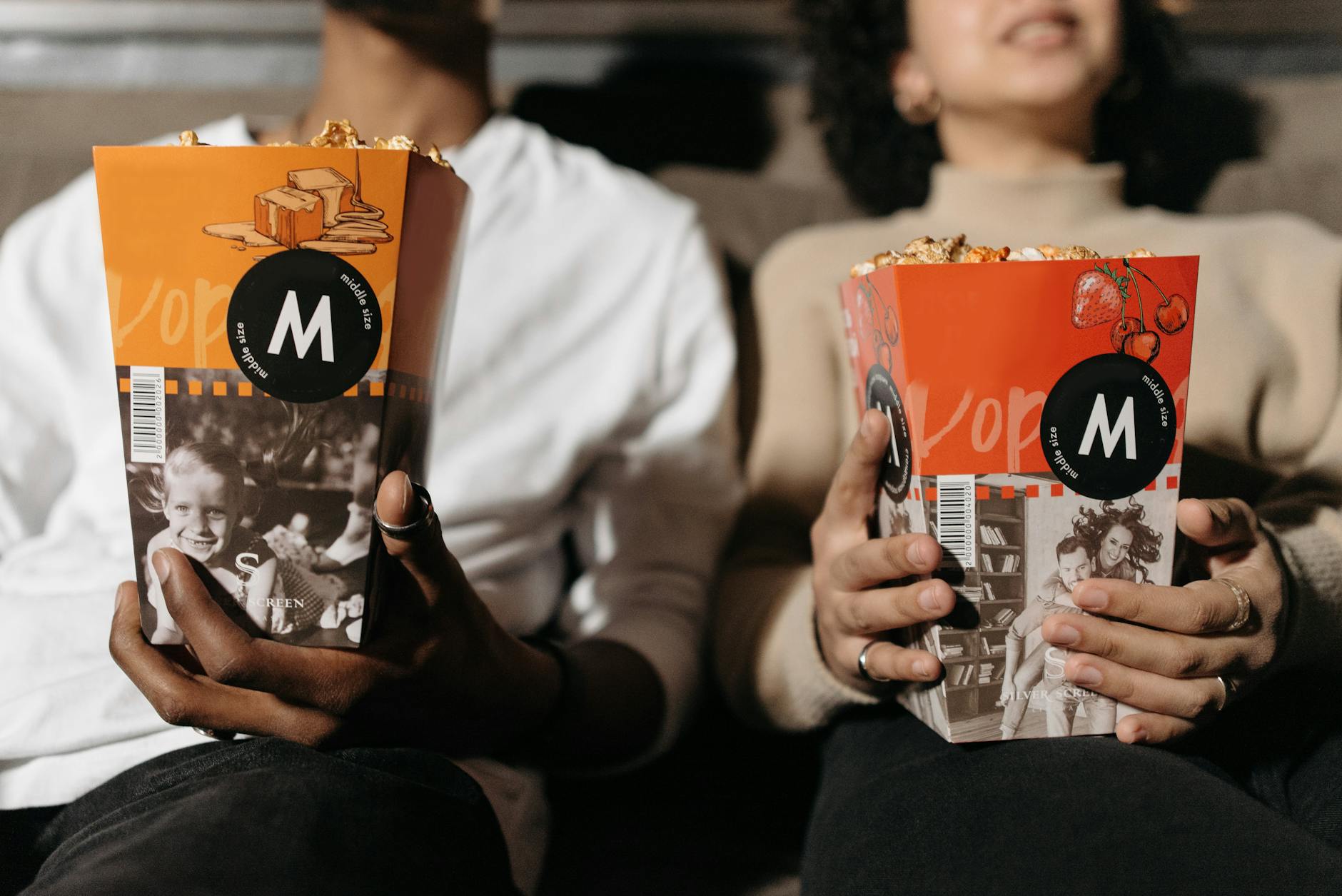 couple watching in cinema with popcorn